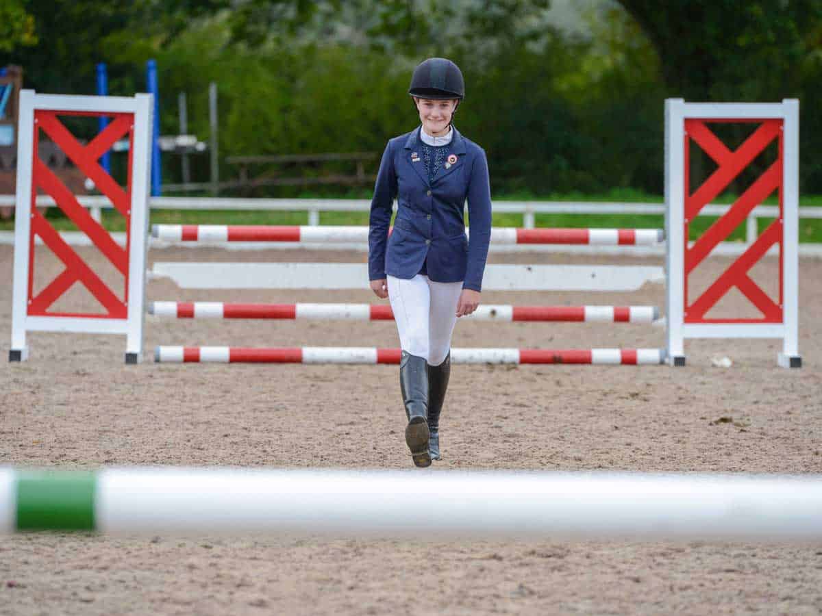 Rider measuring the distance between jumps using her strides